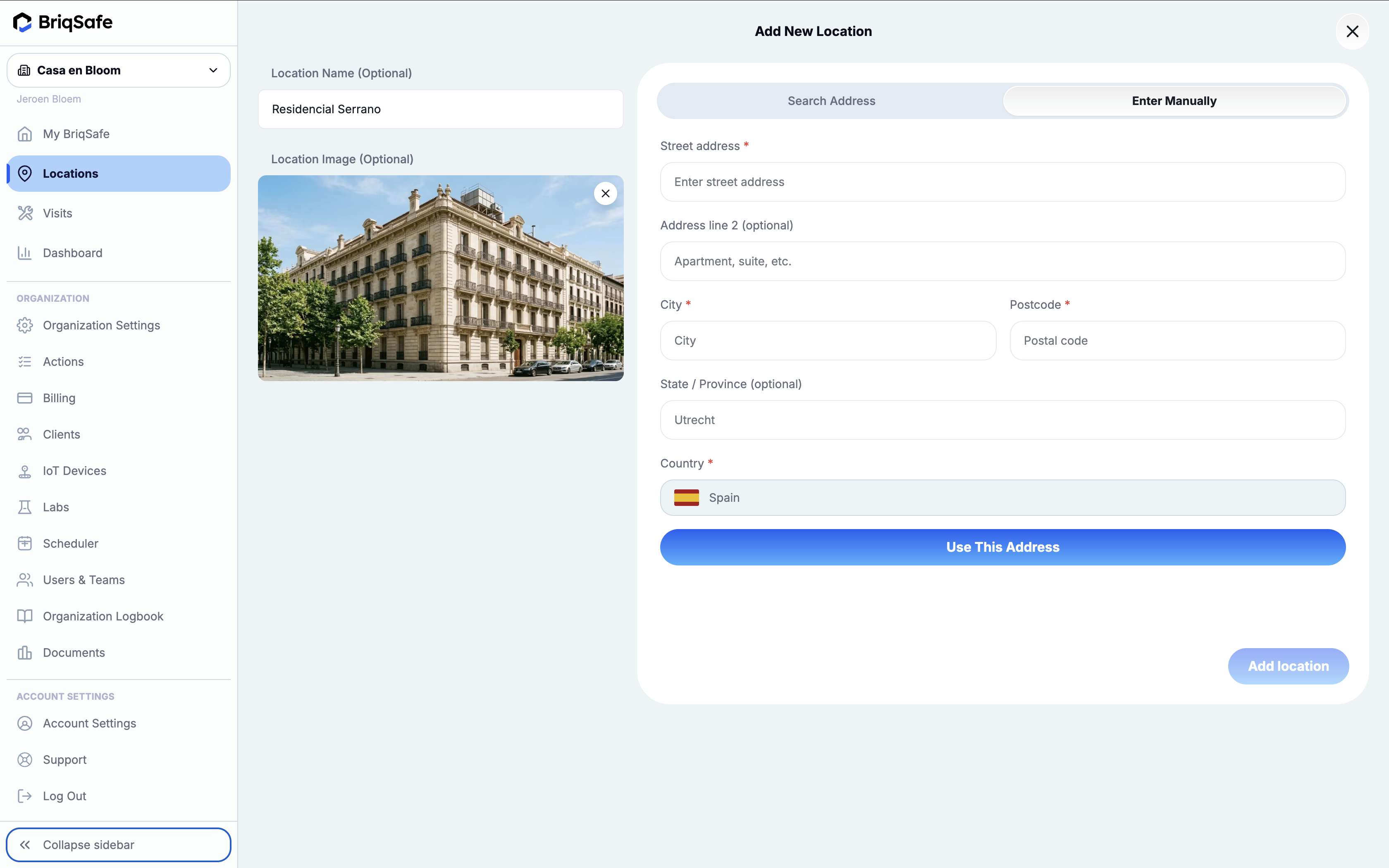 Add New Location screen in BriqSafe allows users to manually enter and save a new address for a location, including optional name and image, with key action buttons for using the entered address and adding the location.
