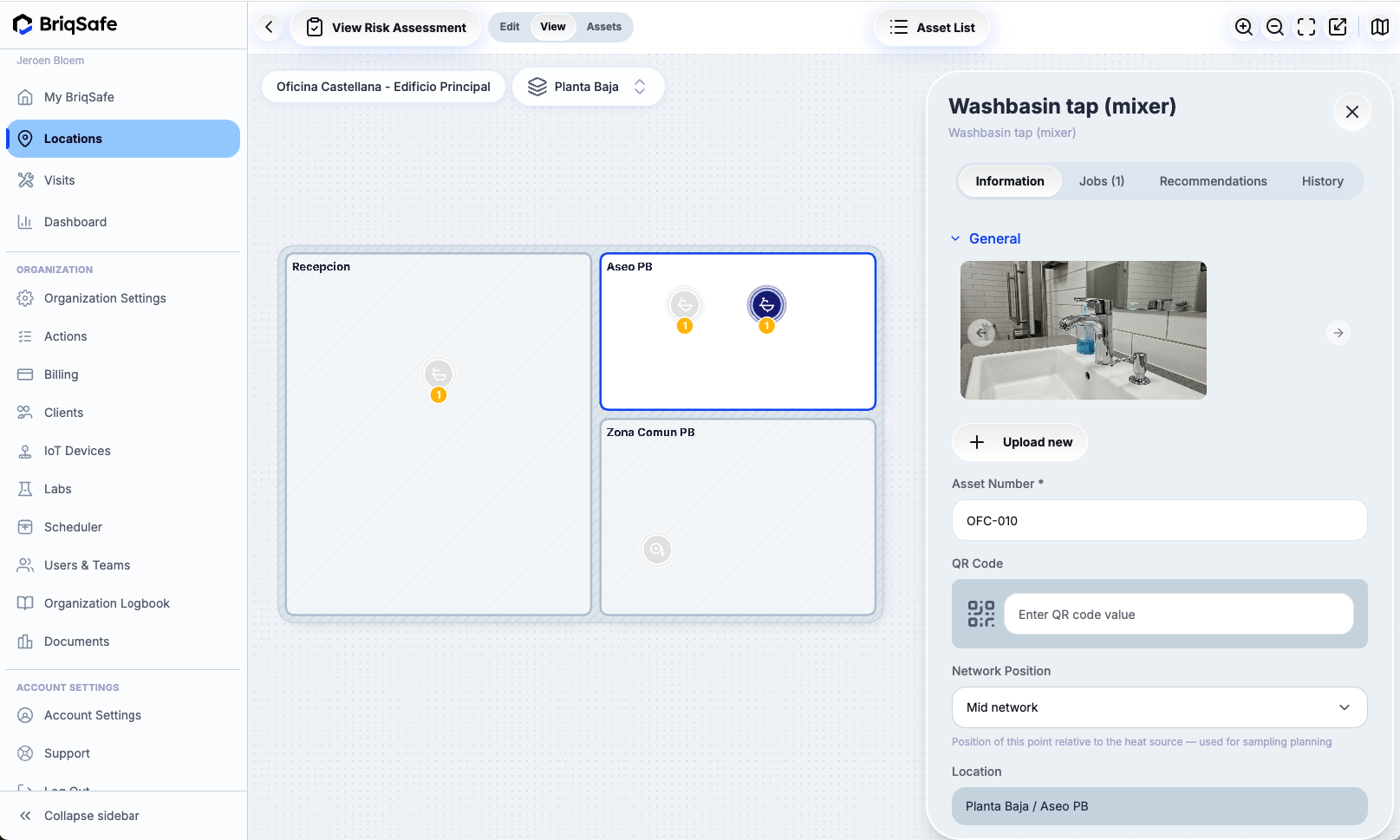 Locations screen showing asset details for a washbasin tap (mixer) including image upload, asset number, QR code entry, and network position settings.