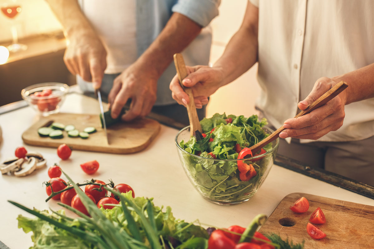 Couple making a salad for dinner