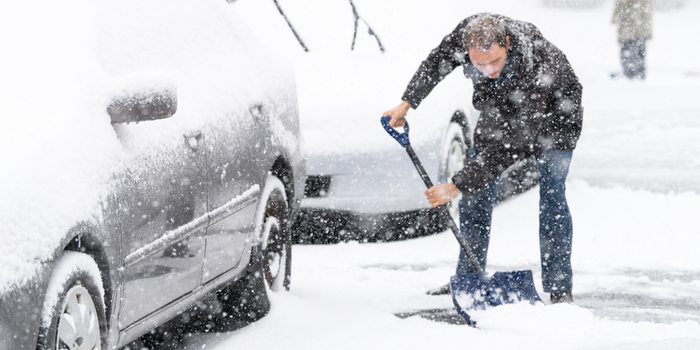 Man Shoveling Snow After Extreme Snow Storm