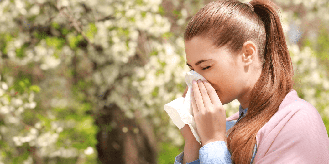 Woman with seasonal allergy symptoms