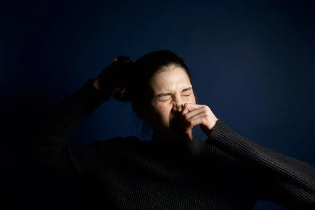 Woman Sneezing Due To Pollen Allergy