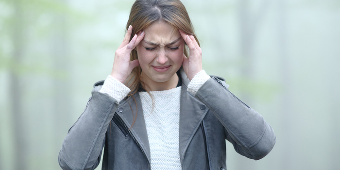 Woman Having A Migraine Due To Air Pollution