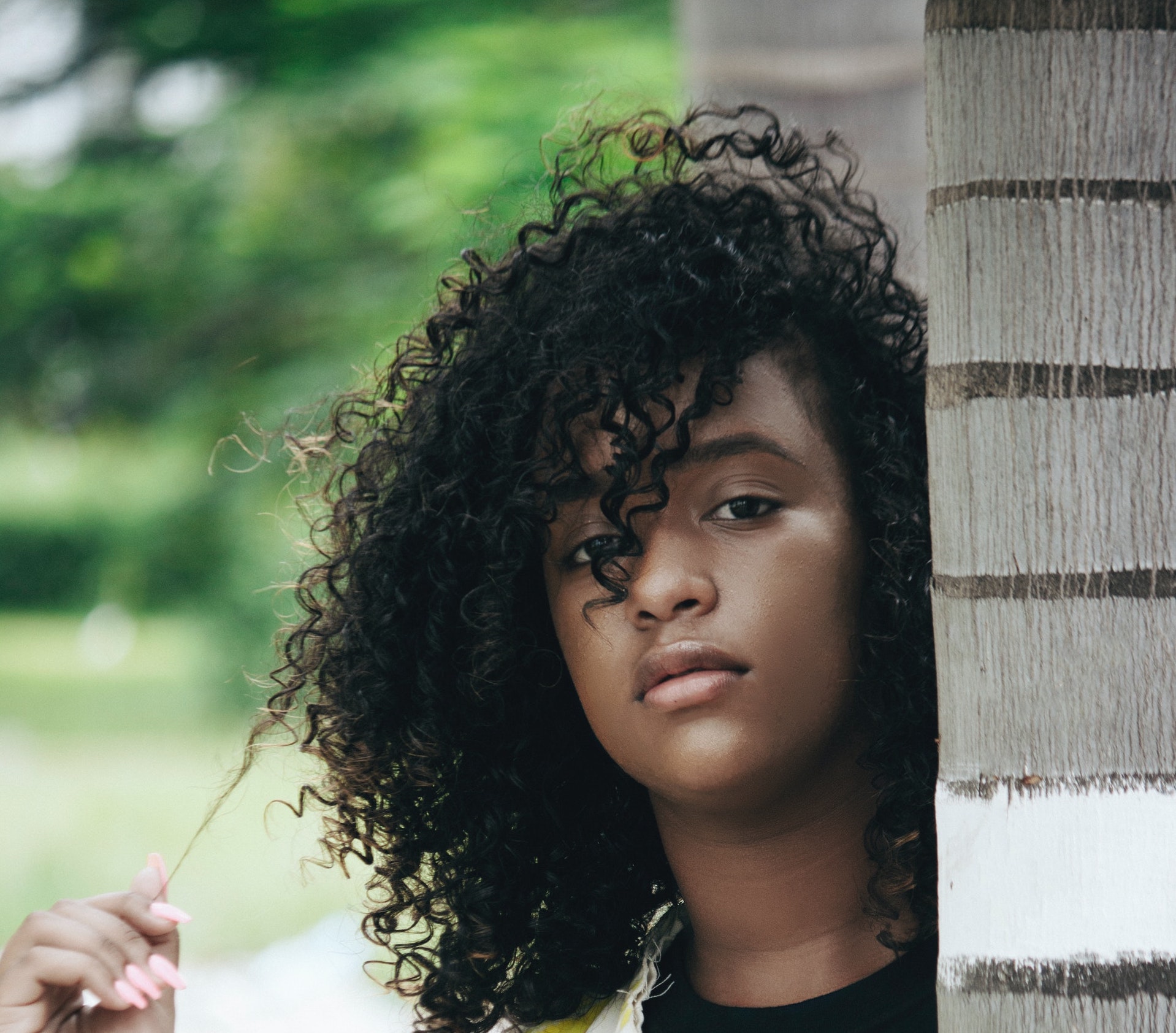 black girl with long curly hair