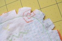 Simple Blanket - Cut notches in rounded corner after sewing and before turning out. Photo by StayAtHomeArtist.com