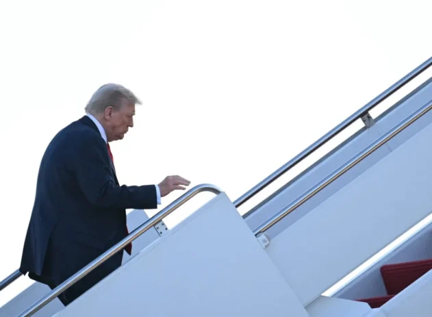 US President Donald Trump boards Air Force One at Joint Base Andrews, Maryland on August 15, 2025, as he heads to Alaska to meet with Russian President. US President Donald Trump departed Washington en route to Alaska Friday for a high-risk summit with his Russian counterpart Vladimir Putin that could prove decisive for the future of Ukraine.