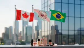 Produtos de maquiagem sobre superfície com bandeiras do Canadá e do Brasil ao fundo.