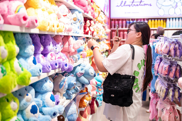 Customer is Selecting Plush Toy in MINISO Store's IP zone