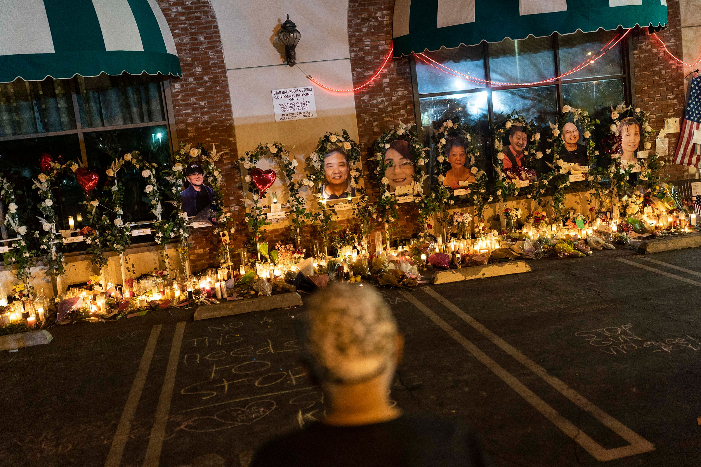 A man visits a memorial outside Star Dance Studio in Monterey Park, Calif, on Jan. 26, 2023.