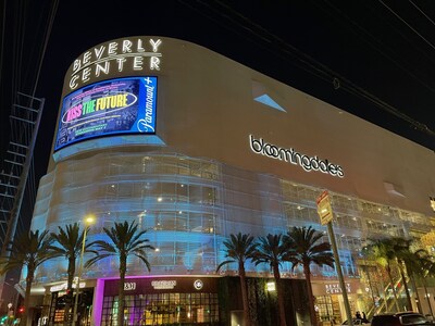 Beverly Center in Los Angeles illuminated in turquoise.