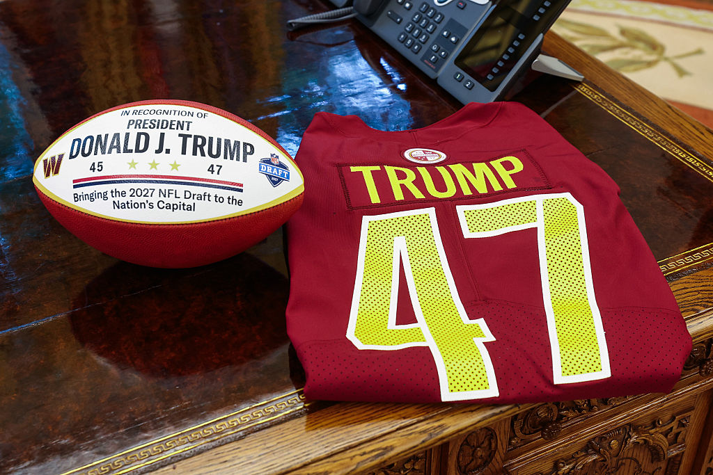 A football and jersey displaying U.S. President Donald Trump's name in the Oval Office of the White House in Washington, D.C., on May 5, 2025. 