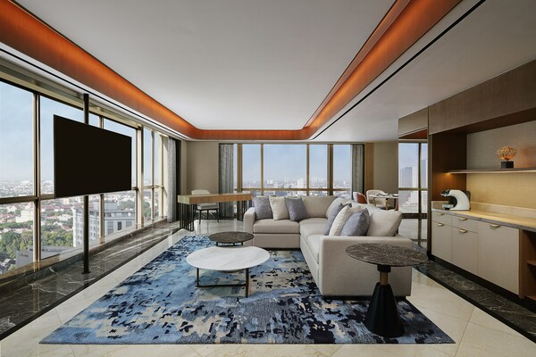 Experience urban vibes and modern luxury from the Ambassador Suite, offering a breathtaking view of the cityscape