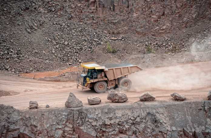 Mining 59 dumper truck driving in a surface mine quarry mining industry t20 b8Q3PB @f51c FREEGOLD INTERSECTS 72.3 M GRADING 2.3 G/T AU AT GOLDEN SUMMIT