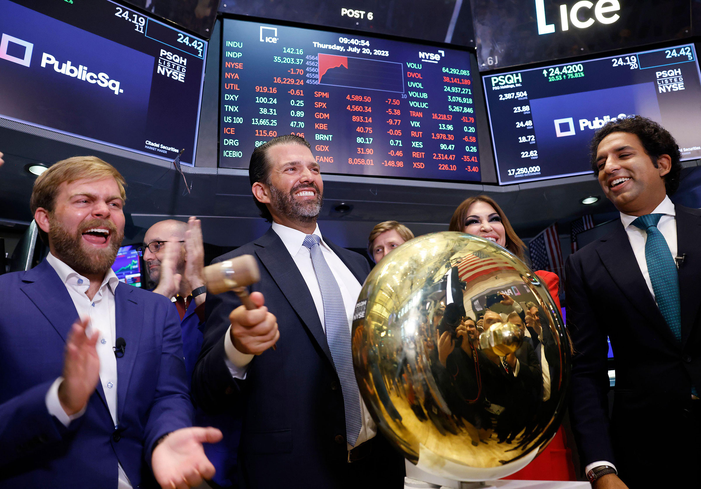 PublicSq. Founder and CEO Michael Seifert, left, Colombier Acquisition Corp. Chairman and CEO Omeed Malik, right, and Donald Trump Jr., center, and Kimberly Guilfoyle ring the ceremonial bell when trading begins for PublicSq. on the floor of the New York Stock Exchange on Wall Street in New York City on Thursday, July 20, 2023.