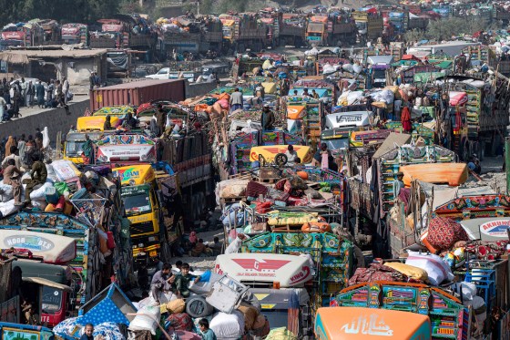 Afghan refugees arrive in trucks from Pakistan at the Afghanistan-Pakistan Torkham border in Nangarhar province on Oct. 30. Islamabad has issued an order to 1.7 million Afghans it says are living in the country illegally to leave by Nov. 1, or be deported.