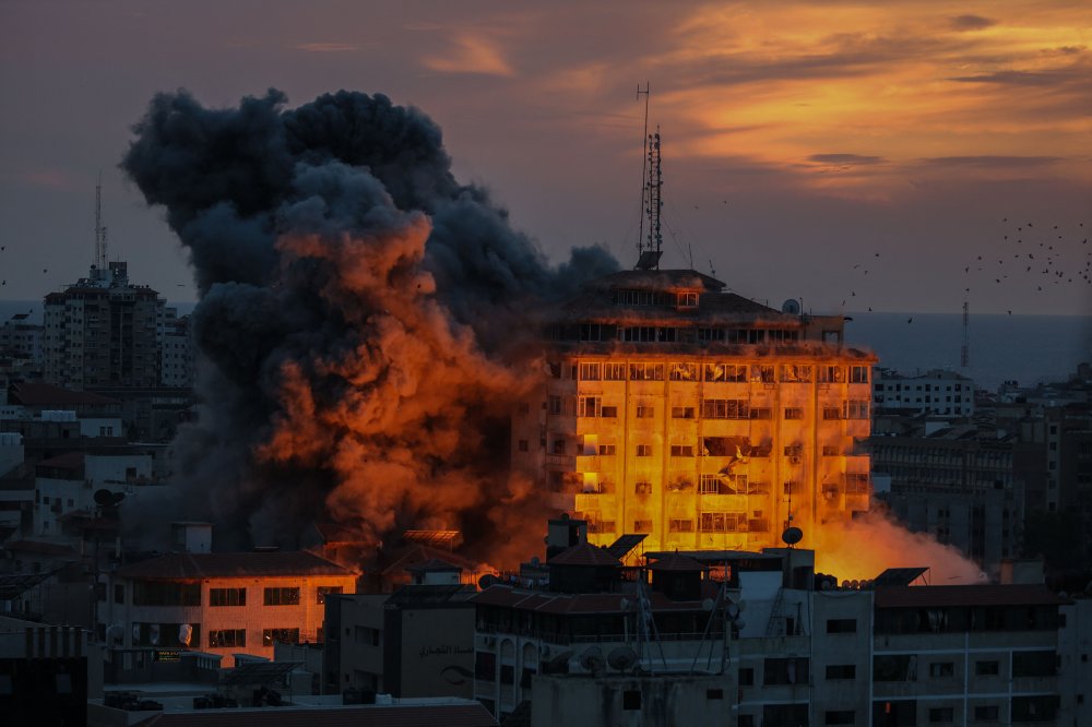 Plumes of smoke fill the sky as a result of Israeli airstrikes in Gaza City, Oct. 7.