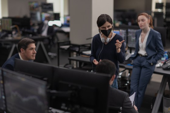 Fair Play, behind the scenes L to R: Rich Sommer as Paul, writer-director Chloe Domont, and Phoebe Dynevor as Emily. Cr. Slobodan Pikula / Courtesy of Netflix