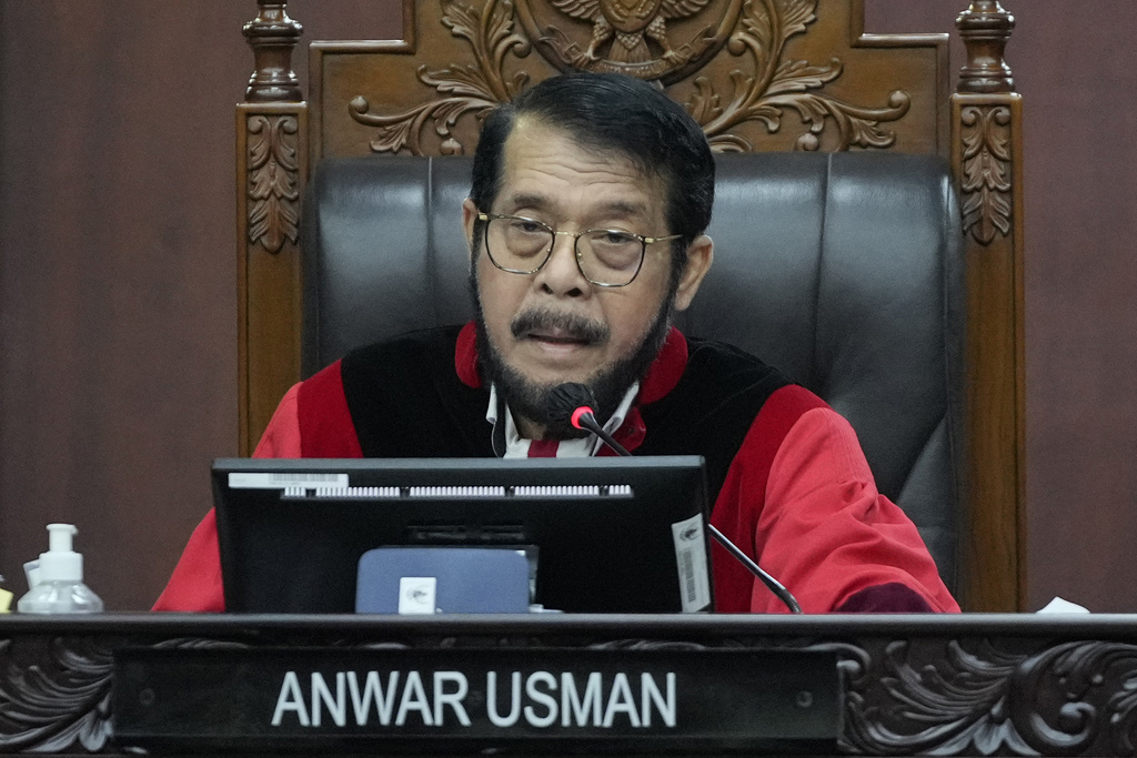 Indonesia's Constitutional Court Chief Justice  Anwar Usman presides over the hearing on a petition seeking to lower the minimum age of presidential and vice presidential candidates in Jakarta, Indonesia, Monday, Oct. 16, 2023. 