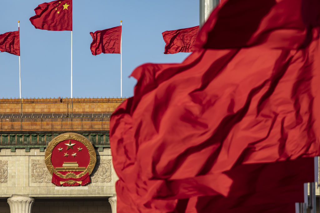 Chinese national flags fly over Tiananmen Square along with other red flags ahead of the fifth plenary session of the First Session of the 14th National People's Congress (NPC) at the Great Hall of the People in Beijing, China, on Sunday, March 12, 2023.  