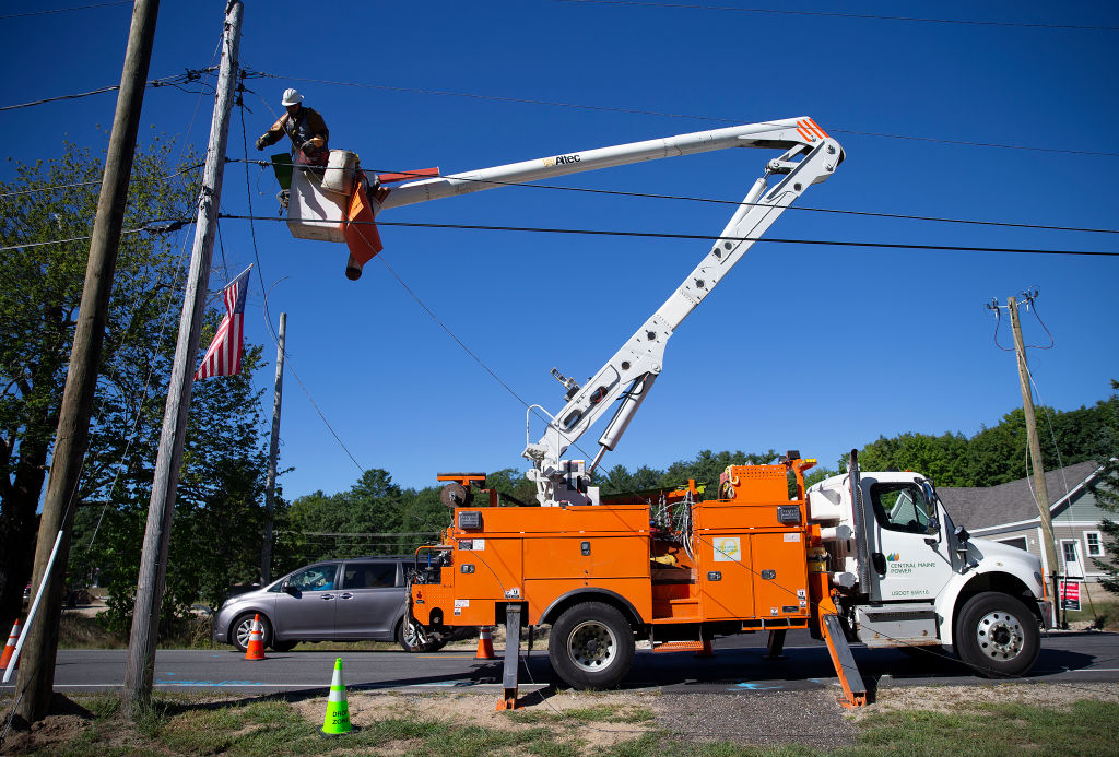 Story about Central Maine Power increase in rates due to the need to transfer lines from old poles to new, more stable utility poles because of increased frquency of storms.