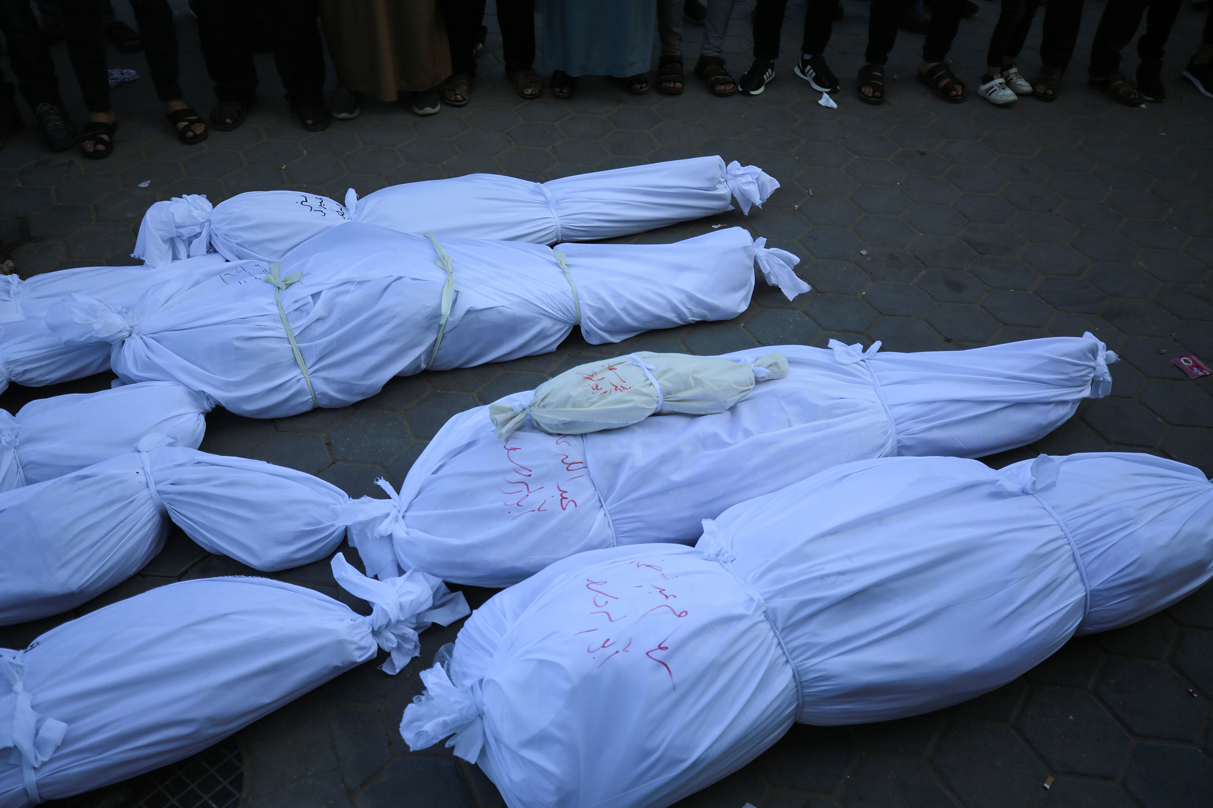 Relatives of Palestinians who lost their lives after Israeli attacks mourn as the bodies are carried for burial outside Al Aqsa Martyrs Hospital in Deir al-Balah in the central Gaza Strip, on Oct. 31.