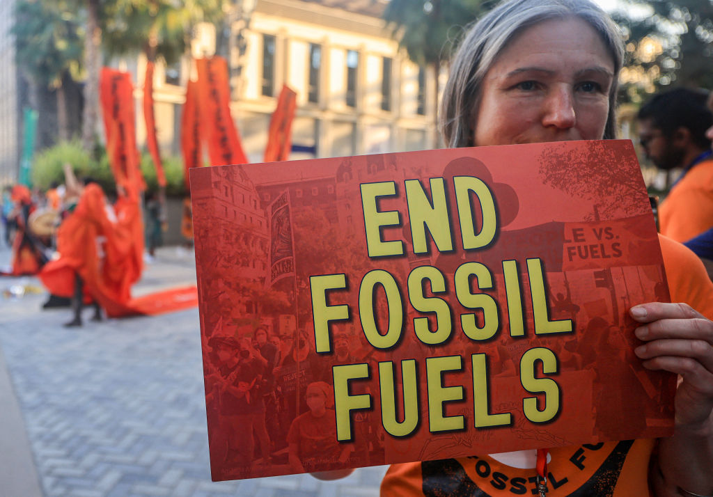 Activists protest against fossil fuels on the sidelines of the COP28 United Nations climate summit in Dubai on Dec. 5, 2023.