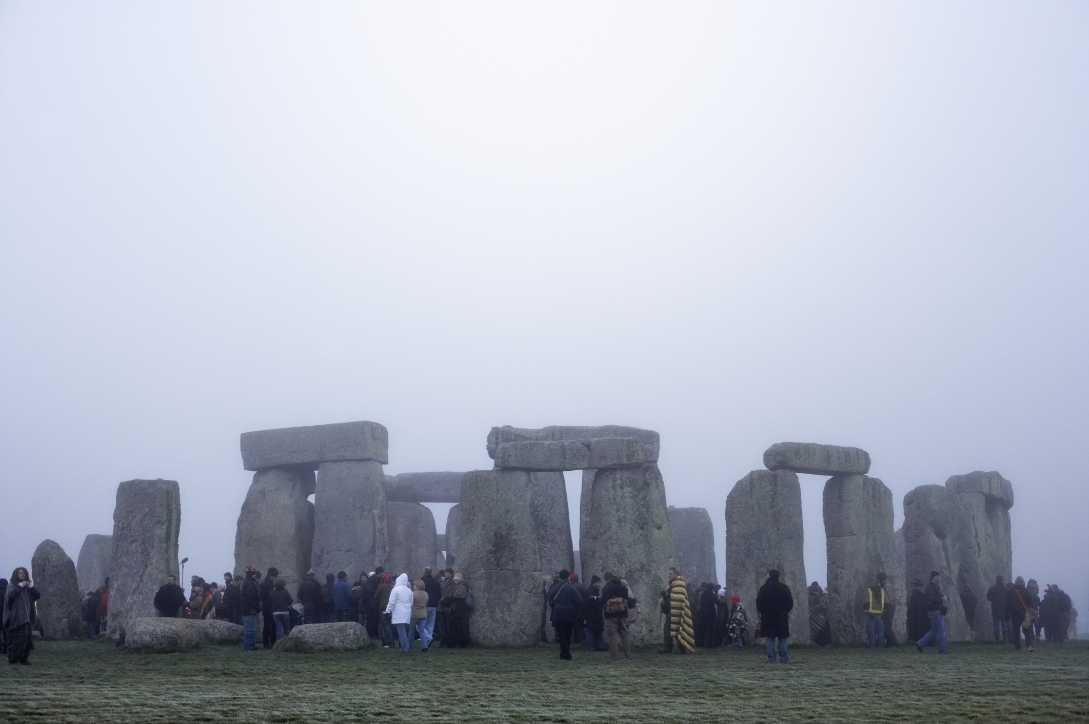 Tourist at Stonehenge in winter