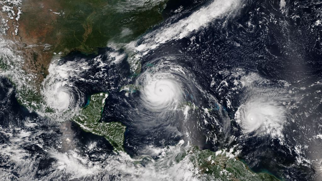 Satellite image of Hurricane Katia (left) making landfall over the Mexican state of Veracruz, Hurricane Irma (center) approaching Cuba, and Hurricane Jose reaching peak intensity on September 8, 2017