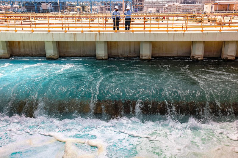 Mohamed Ali al-Qahtani (L), Phase General Manager at the Ras al-Khair water desalination plant, owned by the Saudi government's Saline Water Conversion Corporation, speaks with an employee at the facility in Ras al-Khair along the Gulf coast in eastern Saudi Arabia, on March 30, 2023.