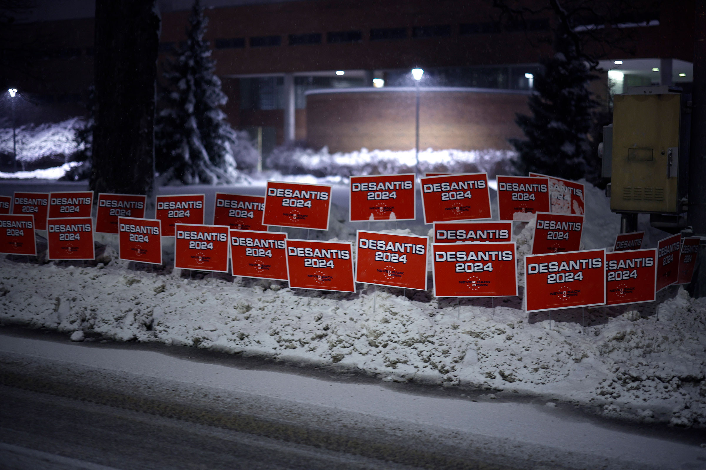 Campaign signs for Florida Gov. Ron Desantis line the road in front of Drake University, where CNN is hosting a presidential debate in Des Moines on Jan. 10, 2024.