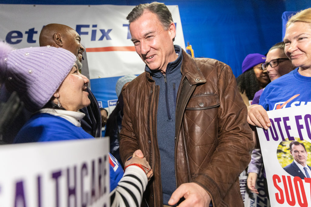 Tom Suozzi, U.S. Democratic House candidate for New York, center, greets an attendee during the Westbury Canvass Launch in Westbury, New York, U.S., on Tuesday, Feb. 13, 2024. 