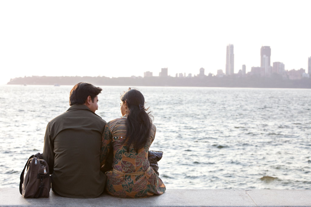 Couple on the seafront at dusk