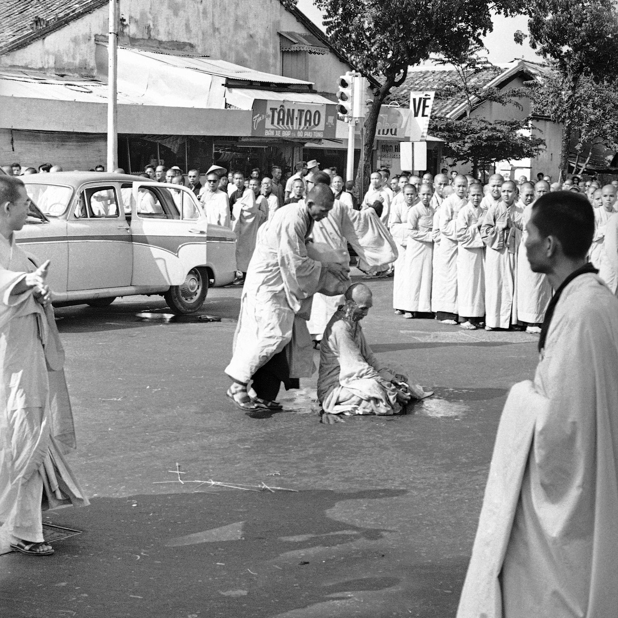 Buddhist monk Thich Quang Duc is doused with gasoline during a protest demonstration in Saigon, on June 11, 1963.