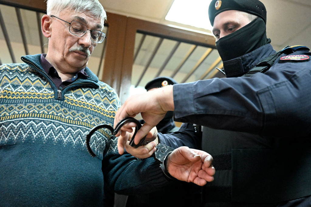 Oleg Orlov handcuffs