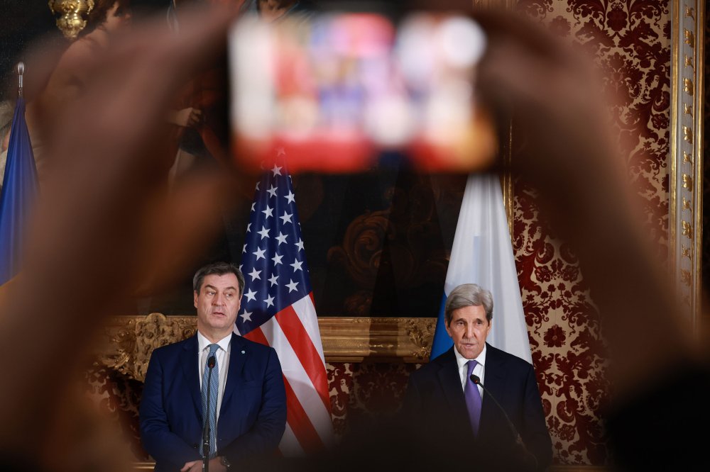 John Kerry is seen on a screen as he speaks during a high-level round table on COP energy and climate commitments organized by the International Energy Agency at its headquarters in Paris on Feb. 20, 2024.