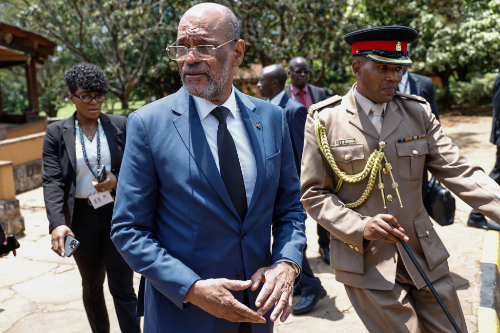 Haitian Prime Minister Ariel Henry, (2nd-L) leaves the auditorium after speaking to students during a public lecture on bilateral engangement between Kenya and Haiti, at the United States International University (USIU) Africa, in Nairobi on March 1, 2024.