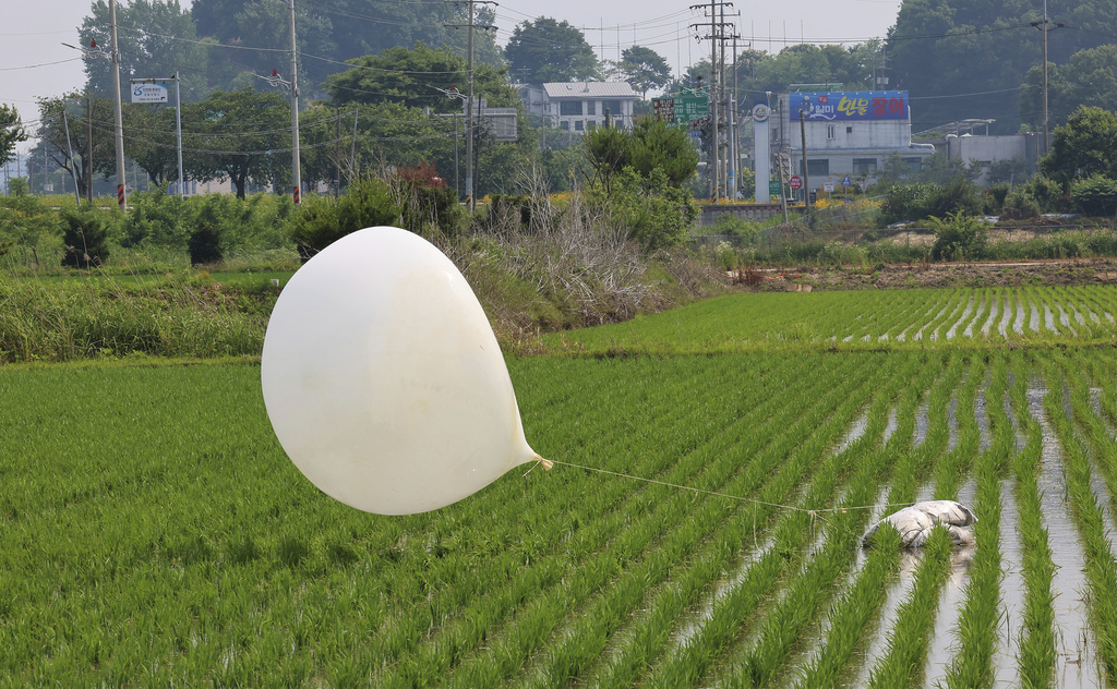 A balloon presumably sent by North Korea, is seen in a paddy field in Incheon, South Korea, on June 10, 2024.