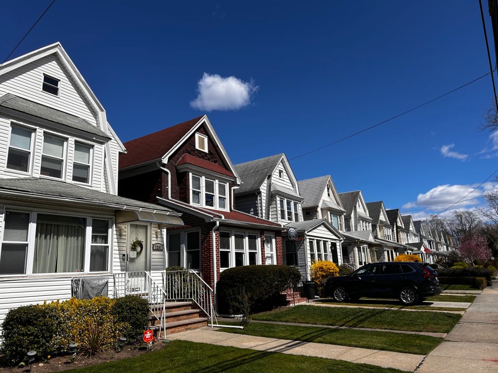 Row of identical houses and yards in Queens, New York