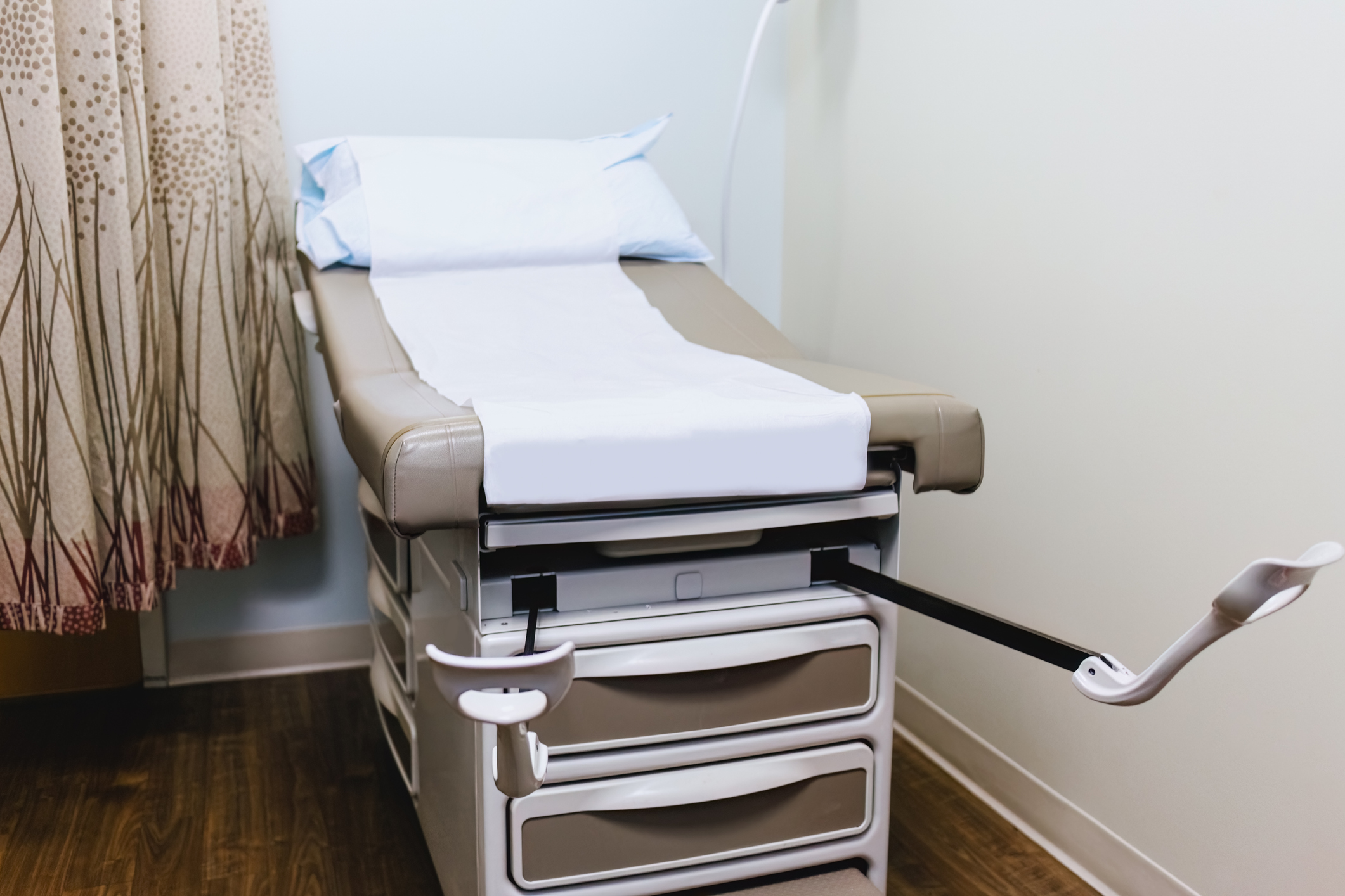 Examination Table With Stirrups in Gynecologist's Office