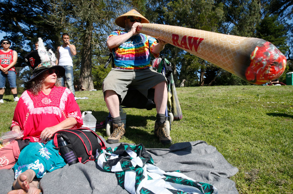 Bear Waite blows up an inflatable joint with his wife Michelle for the annual 4/20 celebration of cannabis on Hippie Hill at Golden Gate Park in San Francisco, Calif. on Friday, April 20, 2018