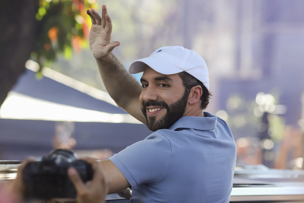 El Salvador President Nayib Bukele, who is seeking re-election, waves to supporters after voting in general elections in San Salvador, El Salvador, Sunday, Feb. 4, 2024.