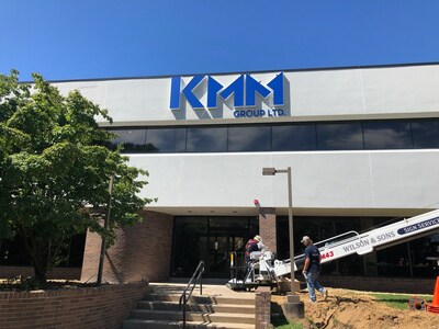 Sign installation at KMM Group Ltd. ultra-precision manufacturing facility