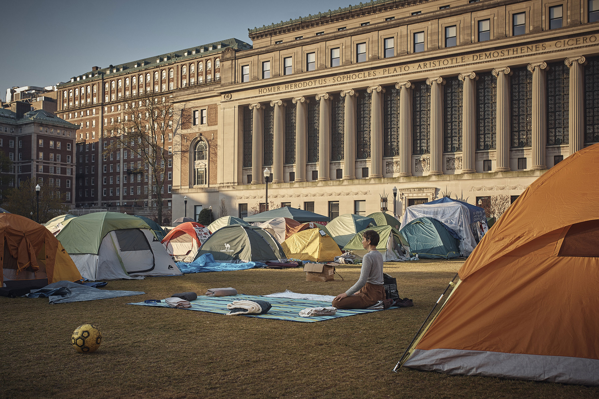 A protestor meditates early Monday morning inside the pro-Palestinian encampment on Columbia University campus in New York City, on April 29, 2024.