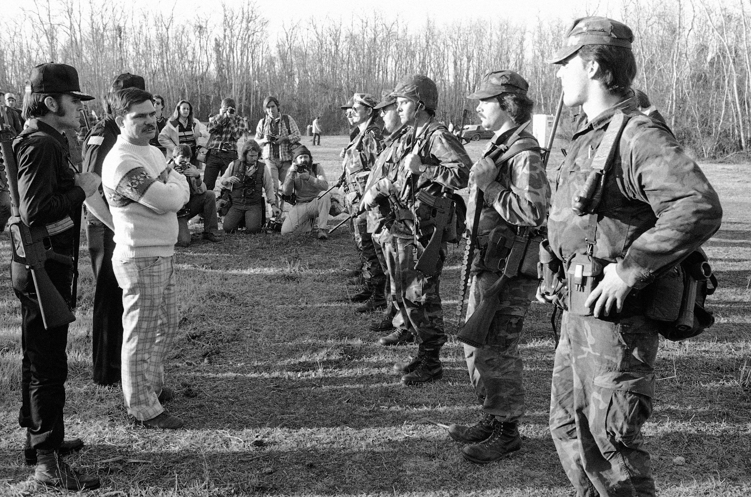 Louis Beam, Grand Dragon of the Texas Realm of the Knights of the Ku Klux Klan, inspecting the security force of the Klan