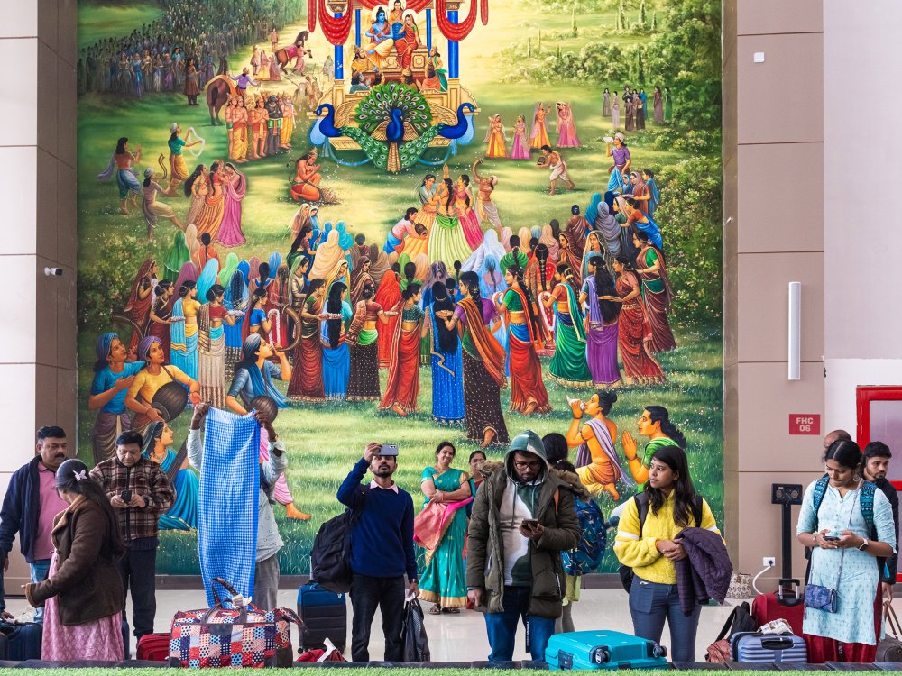 Visitors take photos of a laser light show at the newly consecrated Ram temple in Ayodhya, India, on Jan. 22.