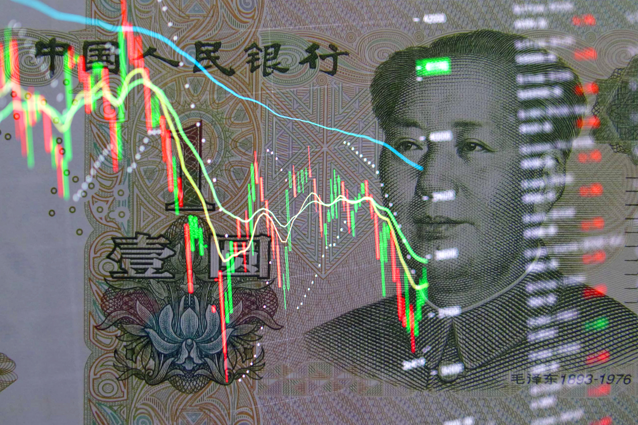 Yuan banknote on the background of stock charts.  Economy of China