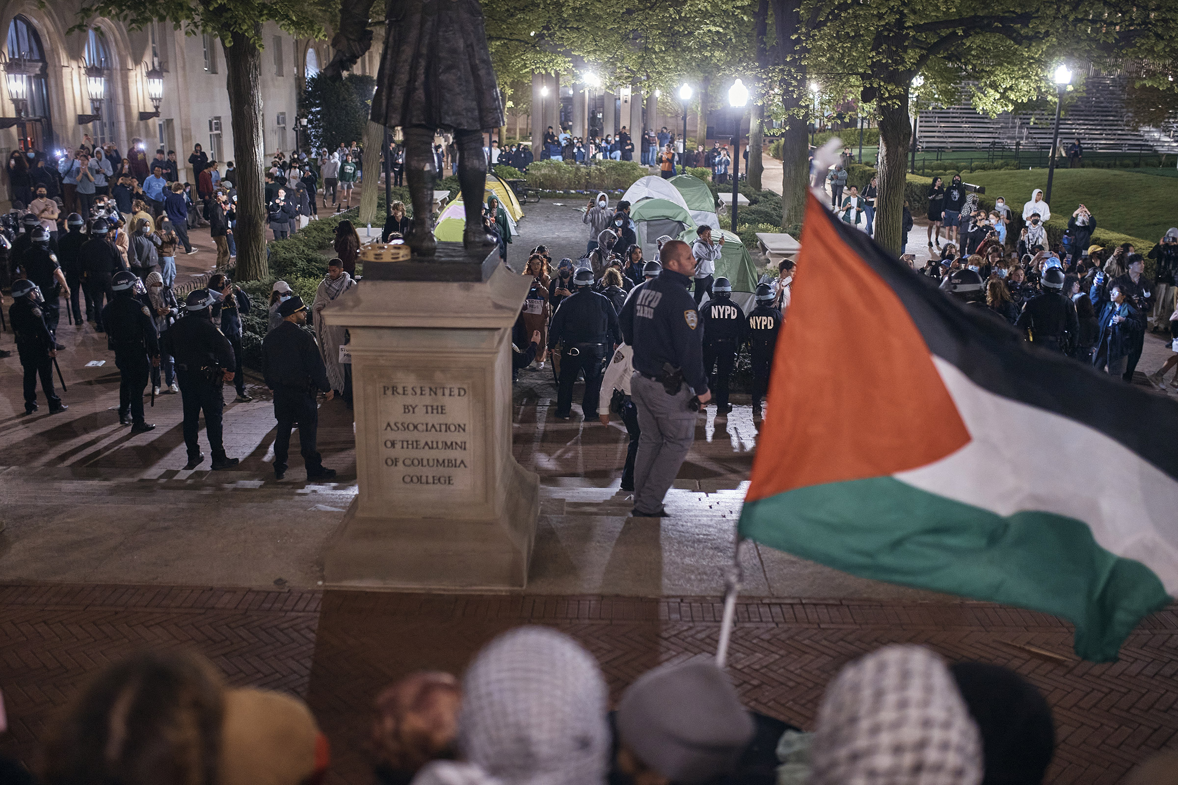 Police secure the area as protestors block the entrance to Hamilton Hall on Columbia University campus in New York City, April 30, 2024.