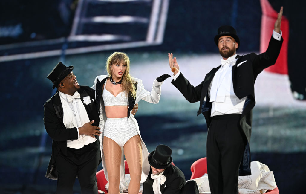 Taylor Swift is joined on stage by Travis Kelce, during 