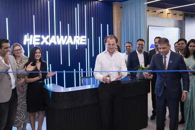 Celebrating New Beginnings - Sir Nigel Wilson and R. Srikrishna mark the occasion with a ceremonial cake, joined by Hexaware leaders and guests for the ribbon-cutting at the new headquarters. Celebrating New Beginnings - Sir Nigel Wilson and R. Srikrishna mark the occasion with a ceremonial cake, joined by Hexaware leaders and guests for the ribbon-cutting at the new headquarters.