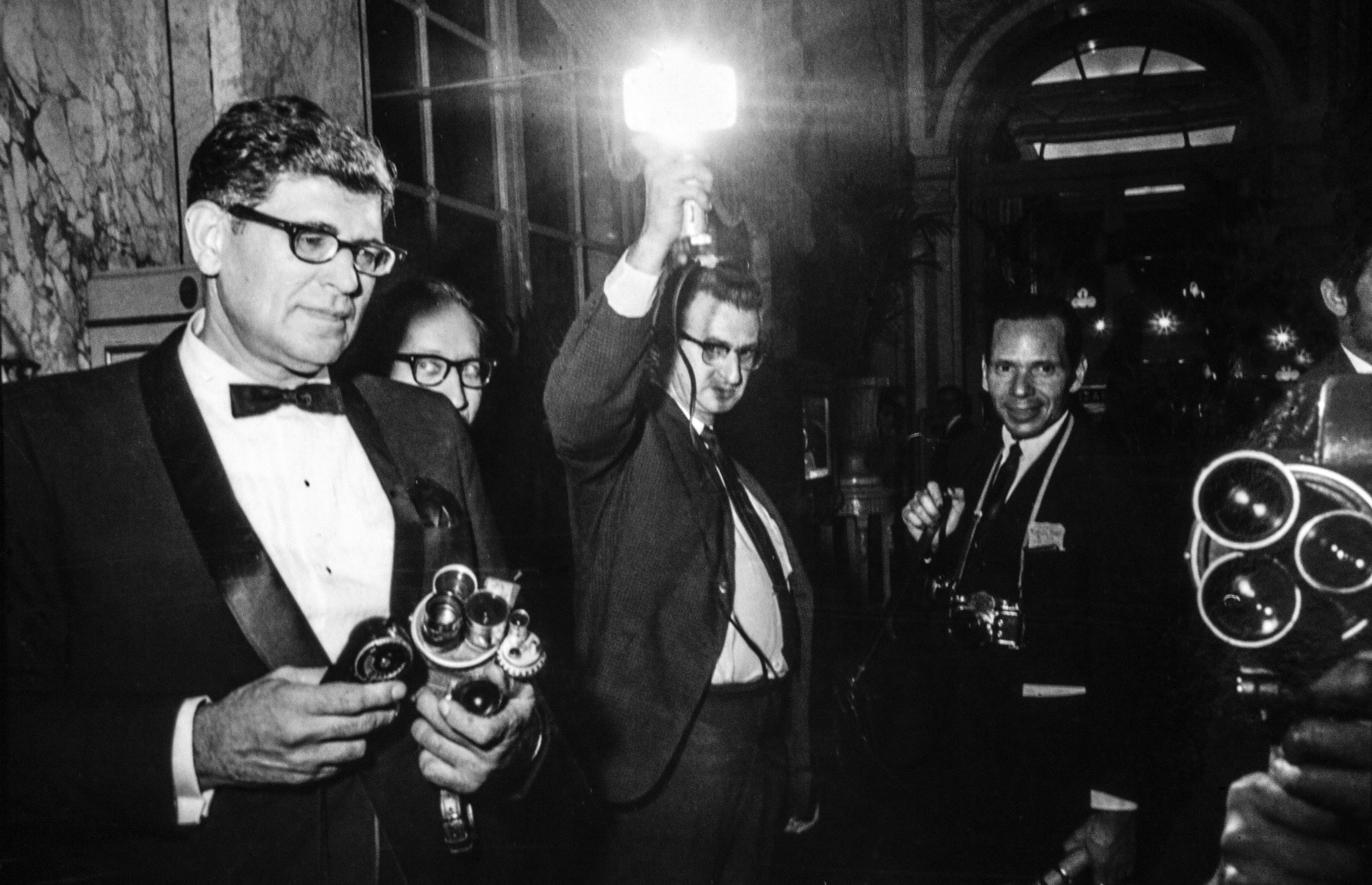 Arrivals at the Black and White Ball, clockwise from top left: Lee Radziwill, interior designer Billy Baldwin, Gordon Parks and his wife Elizabeth Campbell, John Gunther and his wife.